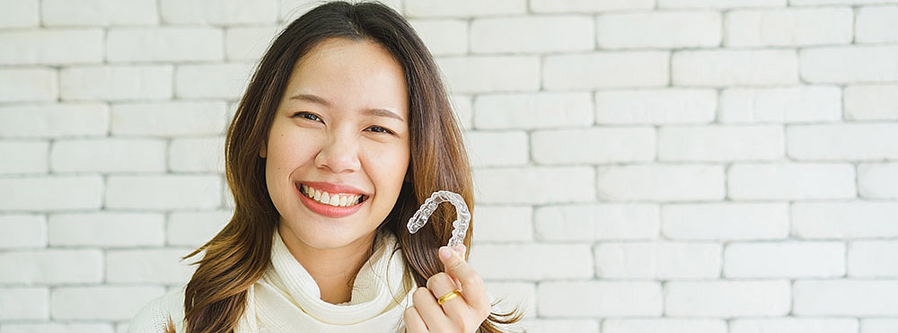 woman with invisalign